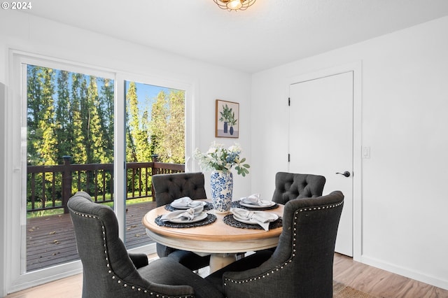 dining area featuring light hardwood / wood-style floors and plenty of natural light