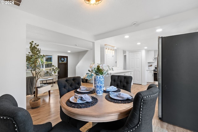 dining room with light wood-type flooring