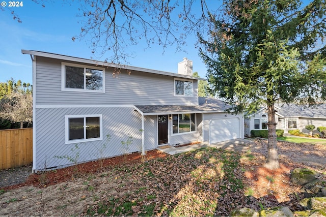 front of property with a garage