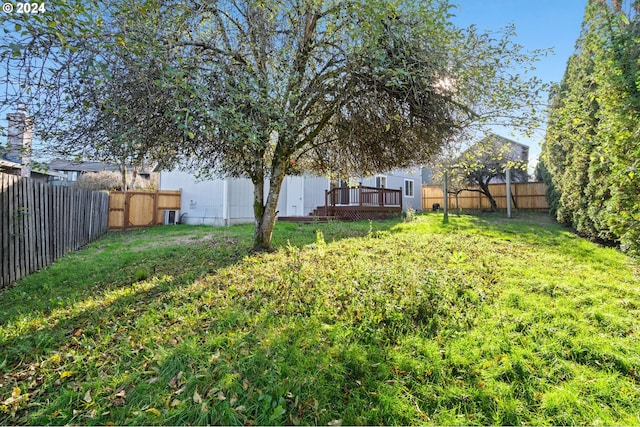 view of yard with a wooden deck