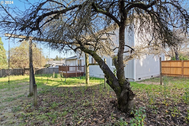 view of yard with a wooden deck