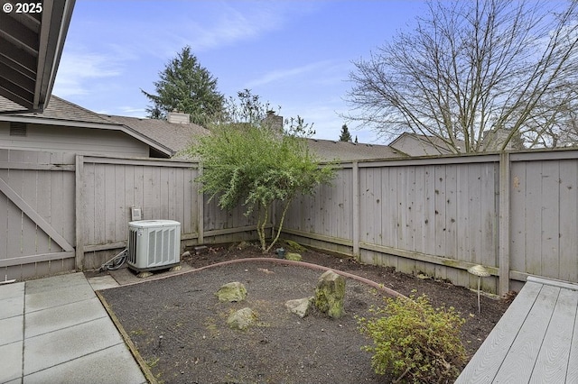 view of yard featuring cooling unit and a fenced backyard