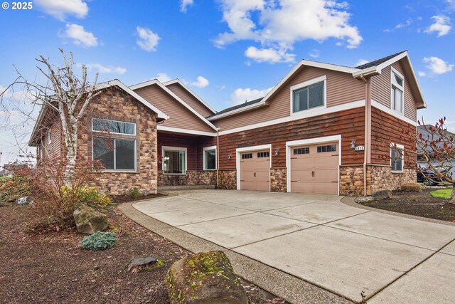 craftsman inspired home with a garage