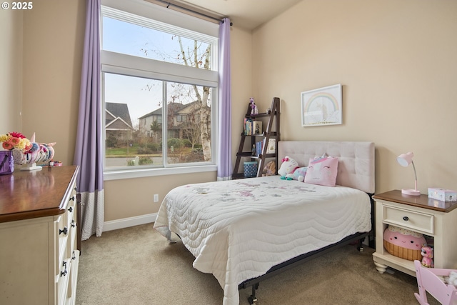 bedroom featuring carpet flooring and baseboards