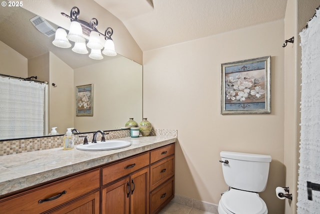 full bathroom with visible vents, toilet, vanity, a textured ceiling, and tile patterned flooring