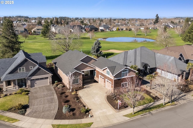 bird's eye view featuring a residential view and a water view