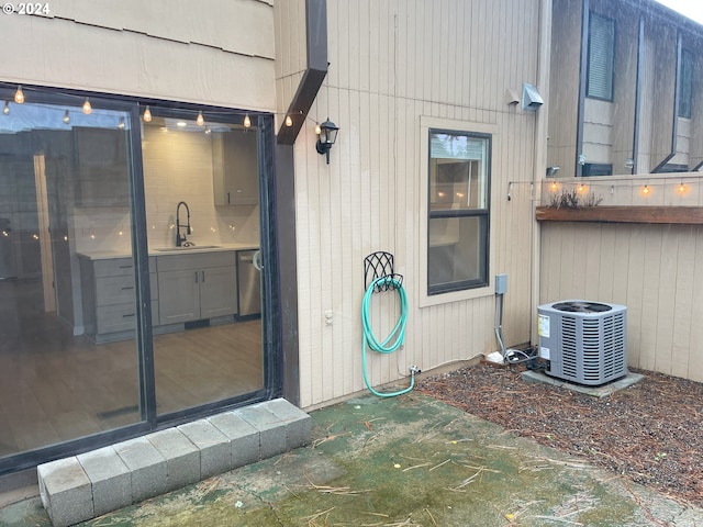 property entrance with sink and central AC unit