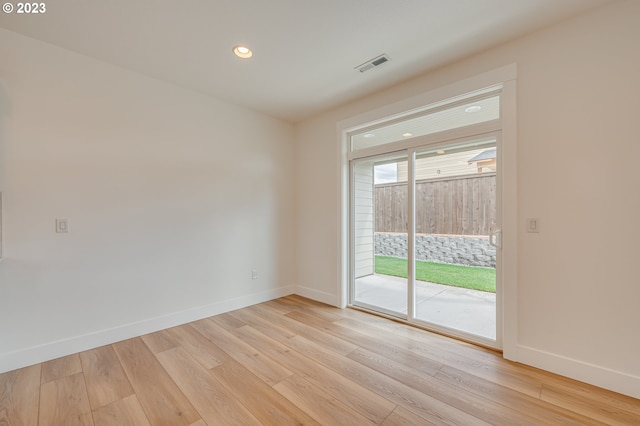 empty room with light wood-type flooring