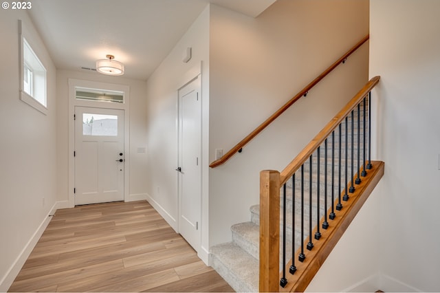 entryway with light hardwood / wood-style floors