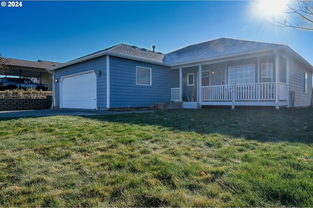 view of front facade featuring a garage, a front yard, and a porch