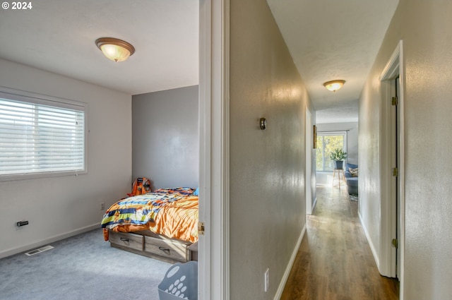 bedroom with hardwood / wood-style floors