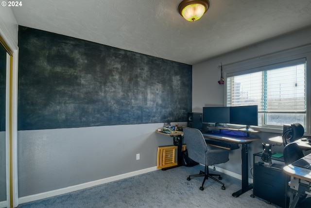 office area with a textured ceiling and carpet floors