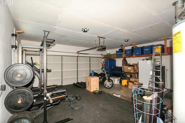 garage featuring a garage door opener and white fridge