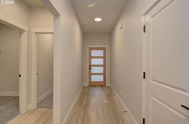 hall with light hardwood / wood-style flooring