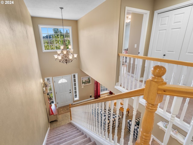 entryway with a chandelier