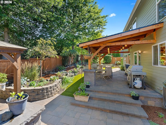 view of patio featuring a grill and a gazebo