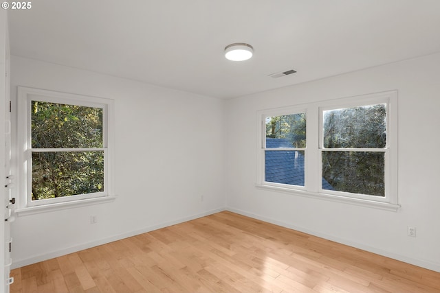 spare room with light wood-type flooring