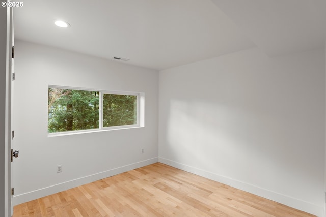 spare room featuring light wood-type flooring