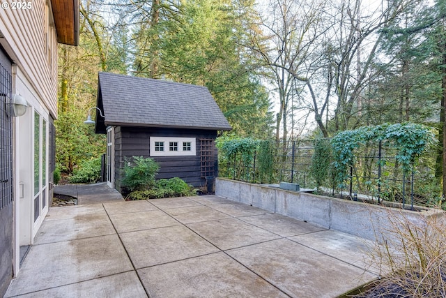 view of patio featuring an outdoor structure