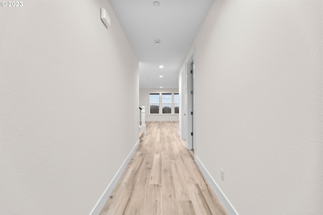 hallway with light wood-type flooring