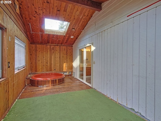 interior space with wooden ceiling and lofted ceiling with skylight