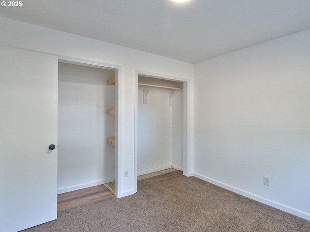 unfurnished bedroom featuring carpet floors and a closet