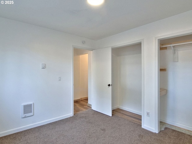 unfurnished bedroom featuring a closet and carpet