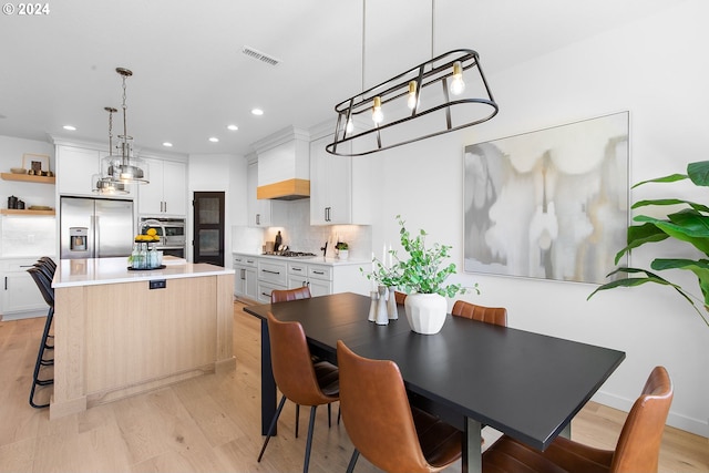 dining room featuring light hardwood / wood-style floors