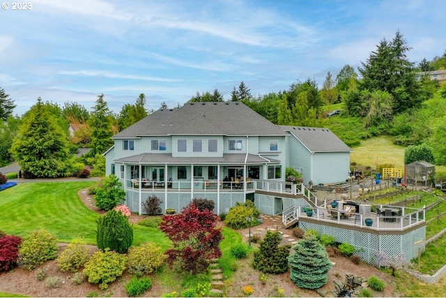 rear view of property with a lawn