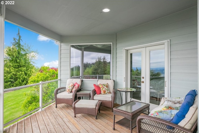 sunroom / solarium featuring french doors