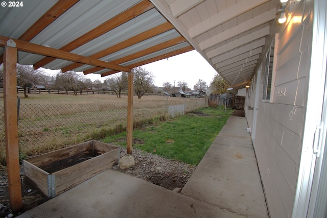 view of yard with a rural view