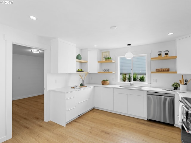 kitchen with appliances with stainless steel finishes, light wood-type flooring, hanging light fixtures, and white cabinets