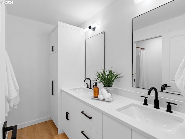 bathroom featuring vanity and wood-type flooring