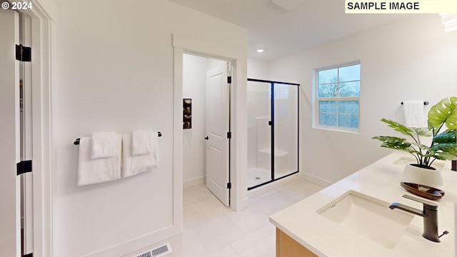 bathroom featuring vanity and walk in shower