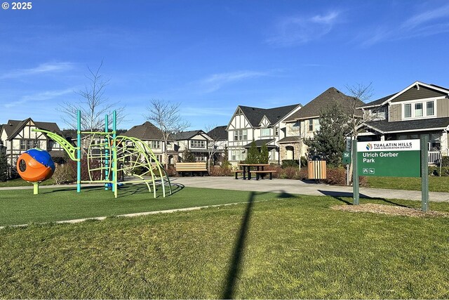 community playground with a yard and a residential view