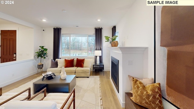 living room with light hardwood / wood-style floors