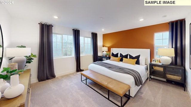 carpeted bedroom with multiple windows