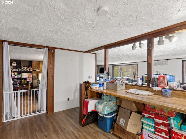 interior space featuring hardwood / wood-style floors and a textured ceiling