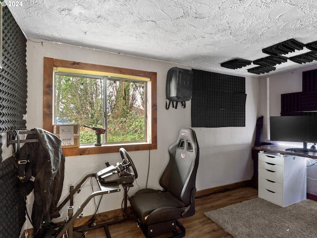 office featuring hardwood / wood-style floors and a textured ceiling