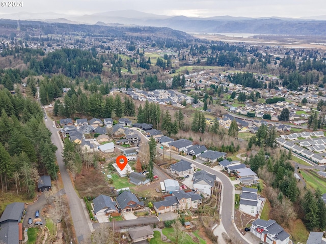 birds eye view of property featuring a mountain view