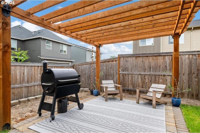 wooden terrace with a pergola and grilling area