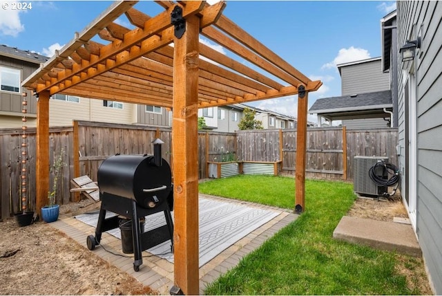 view of yard featuring a pergola and central AC