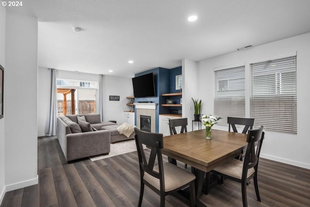 dining space with dark hardwood / wood-style floors