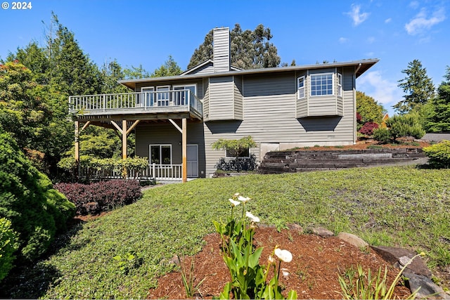 back of house featuring a wooden deck