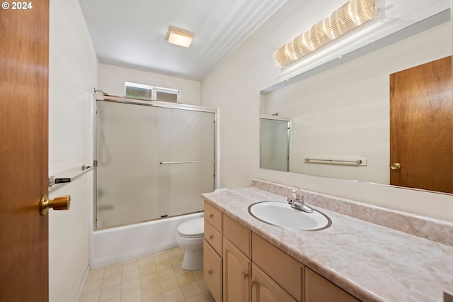 full bathroom featuring tile patterned flooring, vanity, toilet, and combined bath / shower with glass door