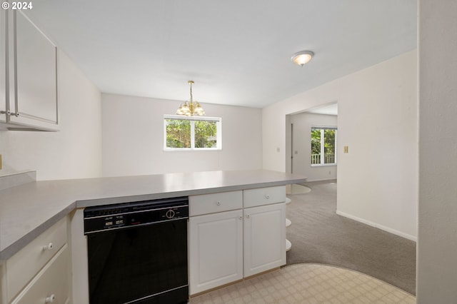 kitchen featuring hanging light fixtures, black dishwasher, kitchen peninsula, light carpet, and white cabinets