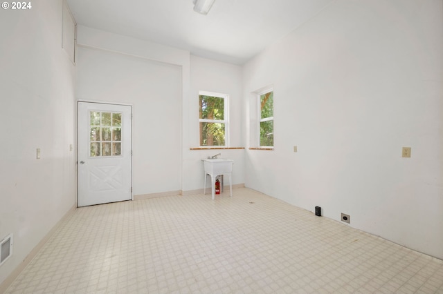 carpeted empty room featuring a healthy amount of sunlight