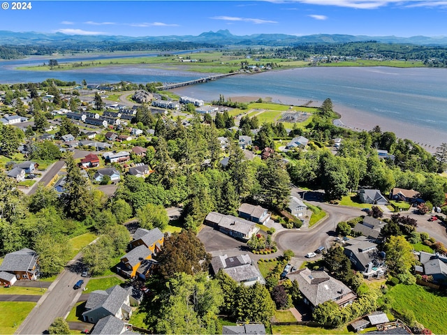 bird's eye view featuring a water and mountain view