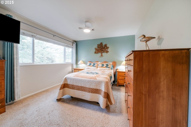 bedroom featuring baseboards, ceiling fan, and carpet