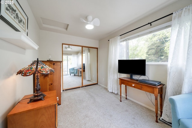 home office featuring carpet, baseboards, and attic access